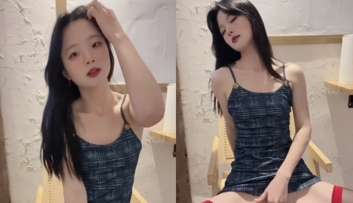 a dance major girl, wearing sexy stockings, massages her vulva.