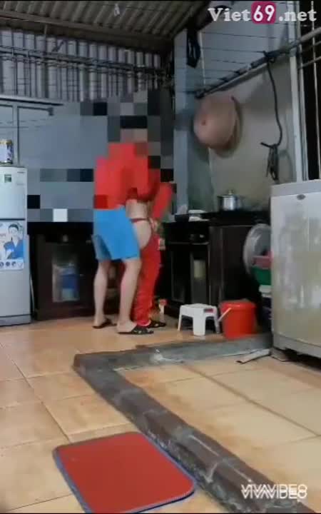 The child is playing in the kitchen.