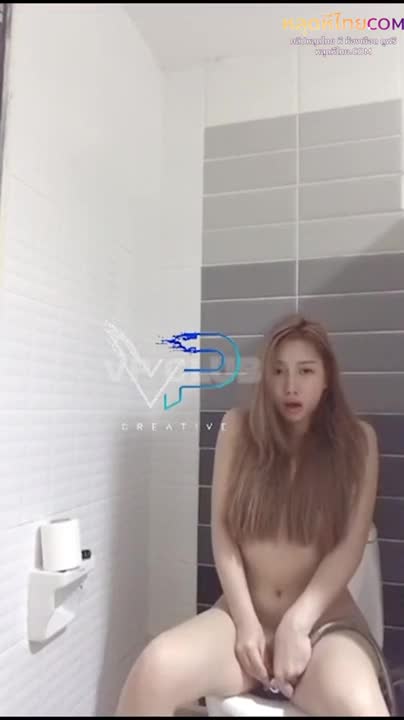 The popular and stunning student confidently adjusts her hair before setting up the camera for a sexy photoshoot.