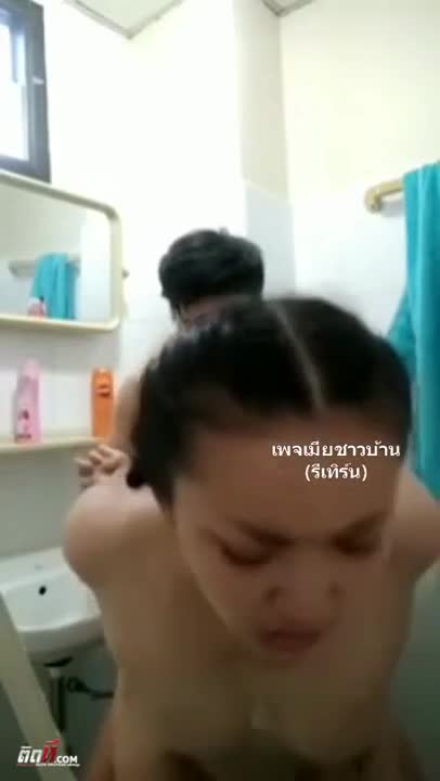 The wife dragged her husband into the bathroom to have sex. She set up a camera and recorded a clip of themselves. She stood up and had doggy style sex.